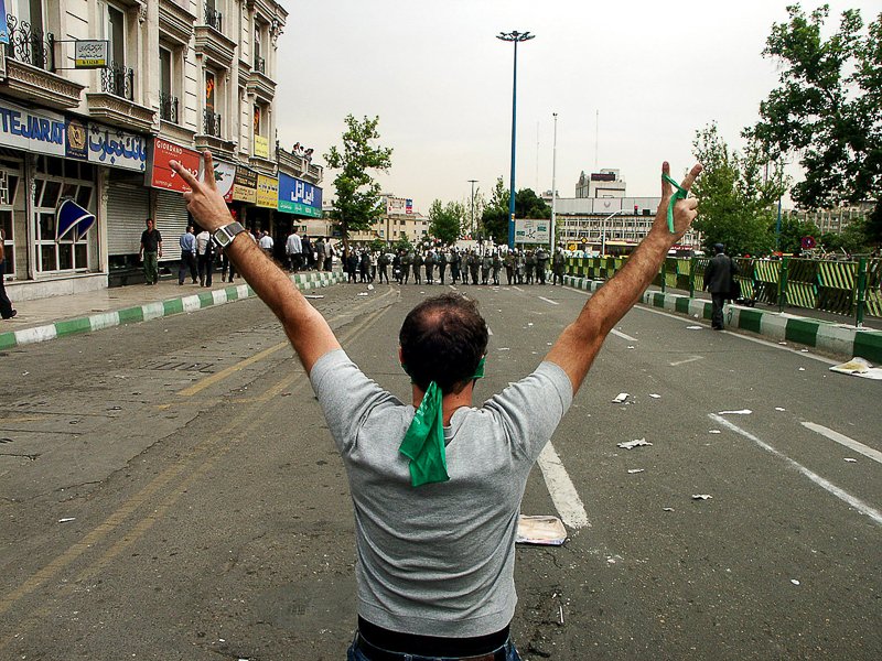 Editorial photograph from the Green Movement protests in Iran during 2009–2010, documenting public demonstrations, civic resistance, and everyday life under heightened security conditions. Part of a long-form documentary project by photographer Farha