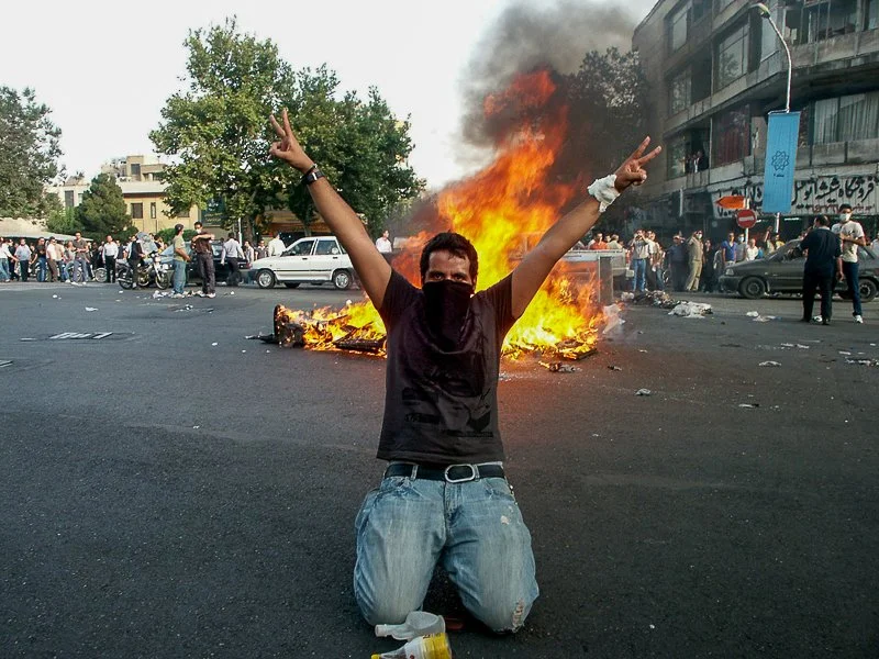 Editorial photograph from the Green Movement protests in Iran during 2009–2010, documenting public demonstrations, civic resistance, and everyday life under heightened security conditions. Part of a long-form documentary project by photographer Farha