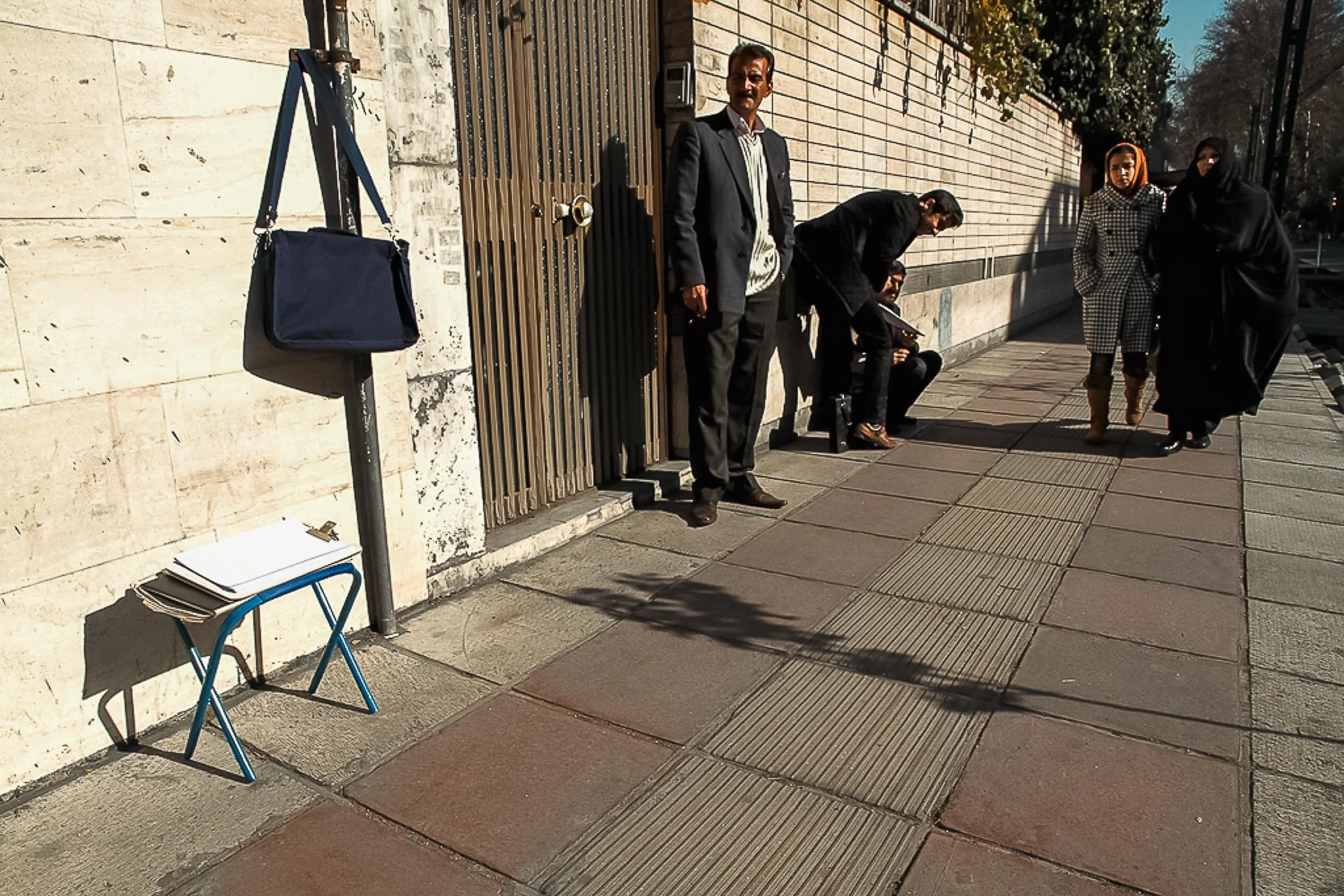 A documentary photo essay about petition writers and citizens seeking government assistance outside the Presidential Office in Tehran, Iran, photographed in December 2011. | photo by Farhad Rajabali