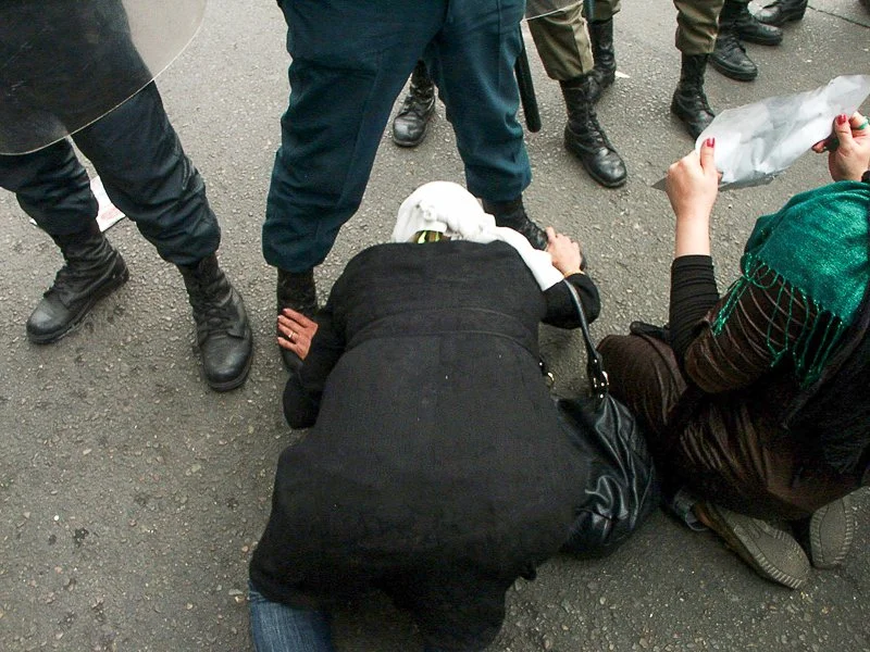 Editorial photograph from the Green Movement protests in Iran during 2009–2010, documenting public demonstrations, civic resistance, and everyday life under heightened security conditions. Part of a long-form documentary project by photographer Farha