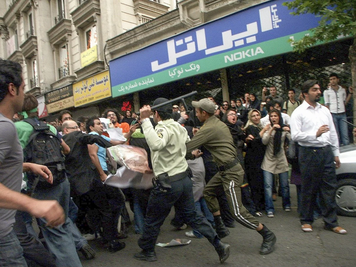 This image is part of the Green Movement documentary series, recorded during the 2009 protests in Tehran, Iran. The project documents everyday scenes and public demonstrations, reflecting resilience, collective presence, and civilian life during a si