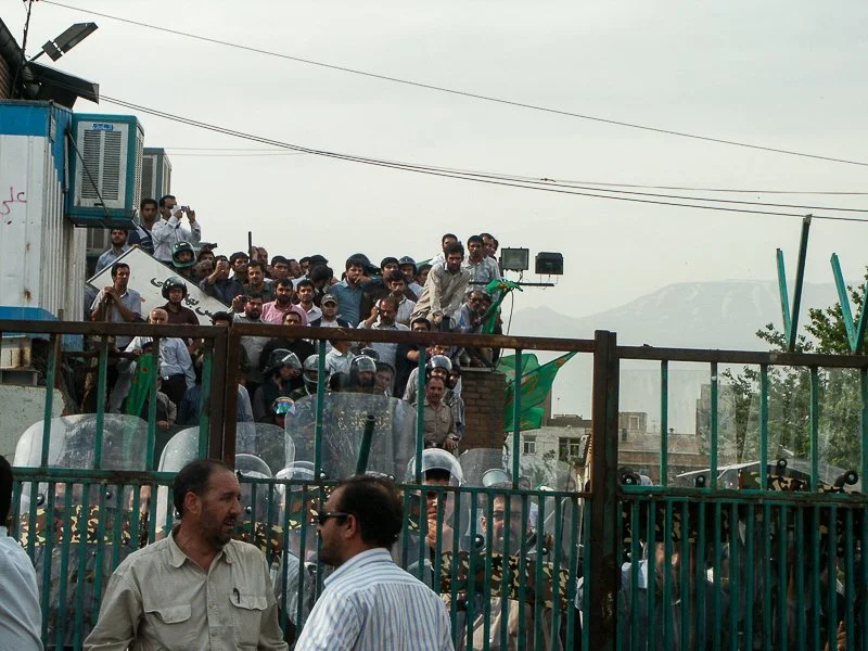 Editorial photograph from the Green Movement protests in Iran during 2009–2010, documenting public demonstrations, civic resistance, and everyday life under heightened security conditions. Part of a long-form documentary project by photographer Farha