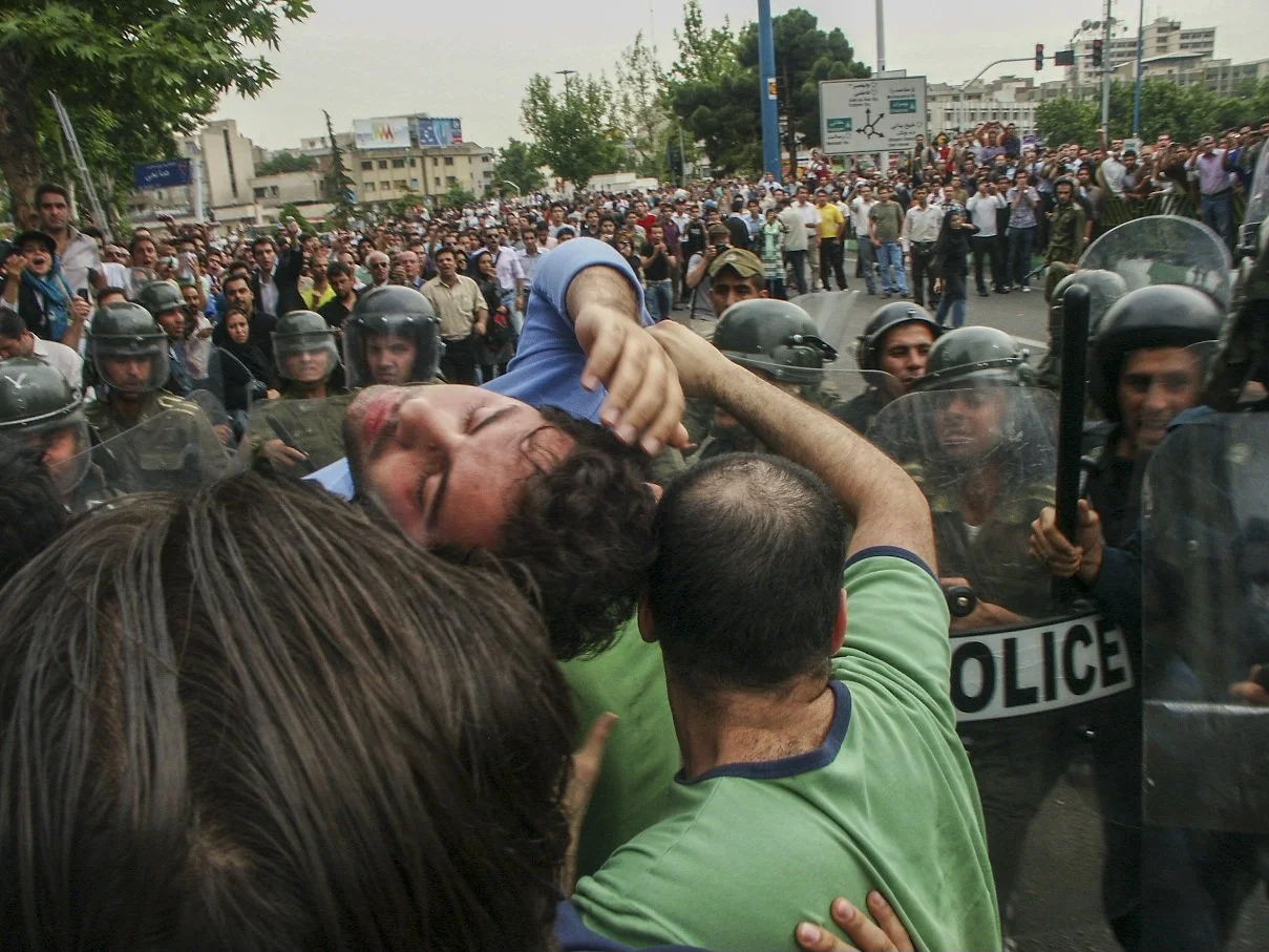 This image is part of the Green Movement documentary series, recorded during the 2009 protests in Tehran, Iran. The project documents everyday scenes and public demonstrations, reflecting resilience, collective presence, and civilian life during a si