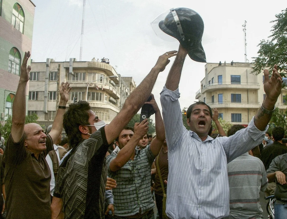 This image is part of the Green Movement documentary series, recorded during the 2009 protests in Tehran, Iran. The project documents everyday scenes and public demonstrations, reflecting resilience, collective presence, and civilian life during a si