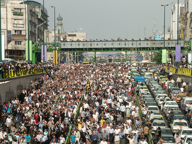 Editorial photograph from the Green Movement protests in Iran during 2009–2010, documenting public demonstrations, civic resistance, and everyday life under heightened security conditions. Part of a long-form documentary project by photographer Farha