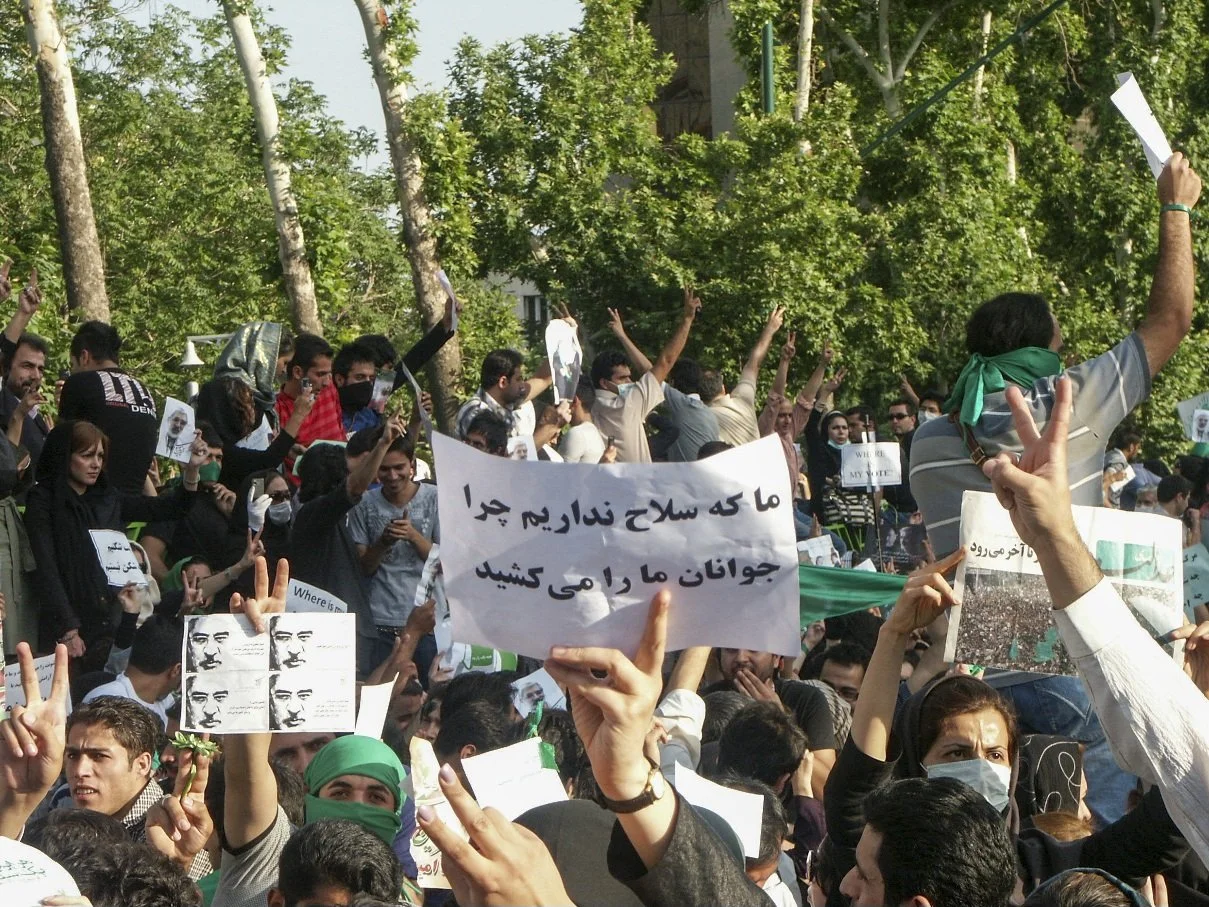 This image is part of the Green Movement documentary series, recorded during the 2009 protests in Tehran, Iran. The project documents everyday scenes and public demonstrations, reflecting resilience, collective presence, and civilian life during a si