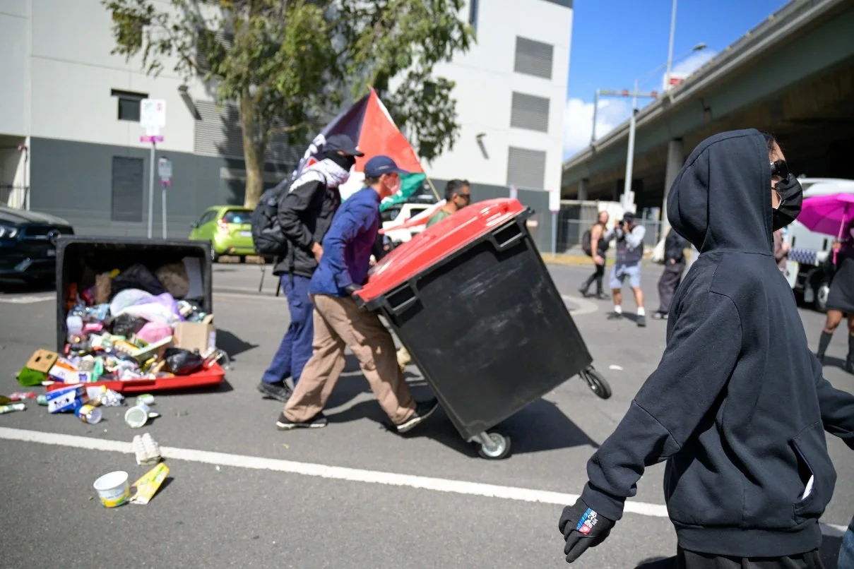 Documentary photograph taken during the Israeli President’s visit to Melbourne on 12 February, capturing protests in Southbank and the CBD, police security measures, and street-level tensions. | photo by Farhad Rajabali