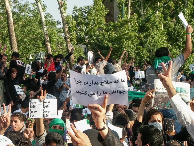 Editorial photograph from the Green Movement protests in Iran during 2009–2010, documenting public demonstrations, civic resistance, and everyday life under heightened security conditions. Part of a long-form documentary project by photographer Farha