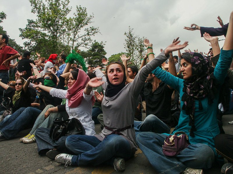 Editorial photograph from the Green Movement protests in Iran during 2009–2010, documenting public demonstrations, civic resistance, and everyday life under heightened security conditions. Part of a long-form documentary project by photographer Farha