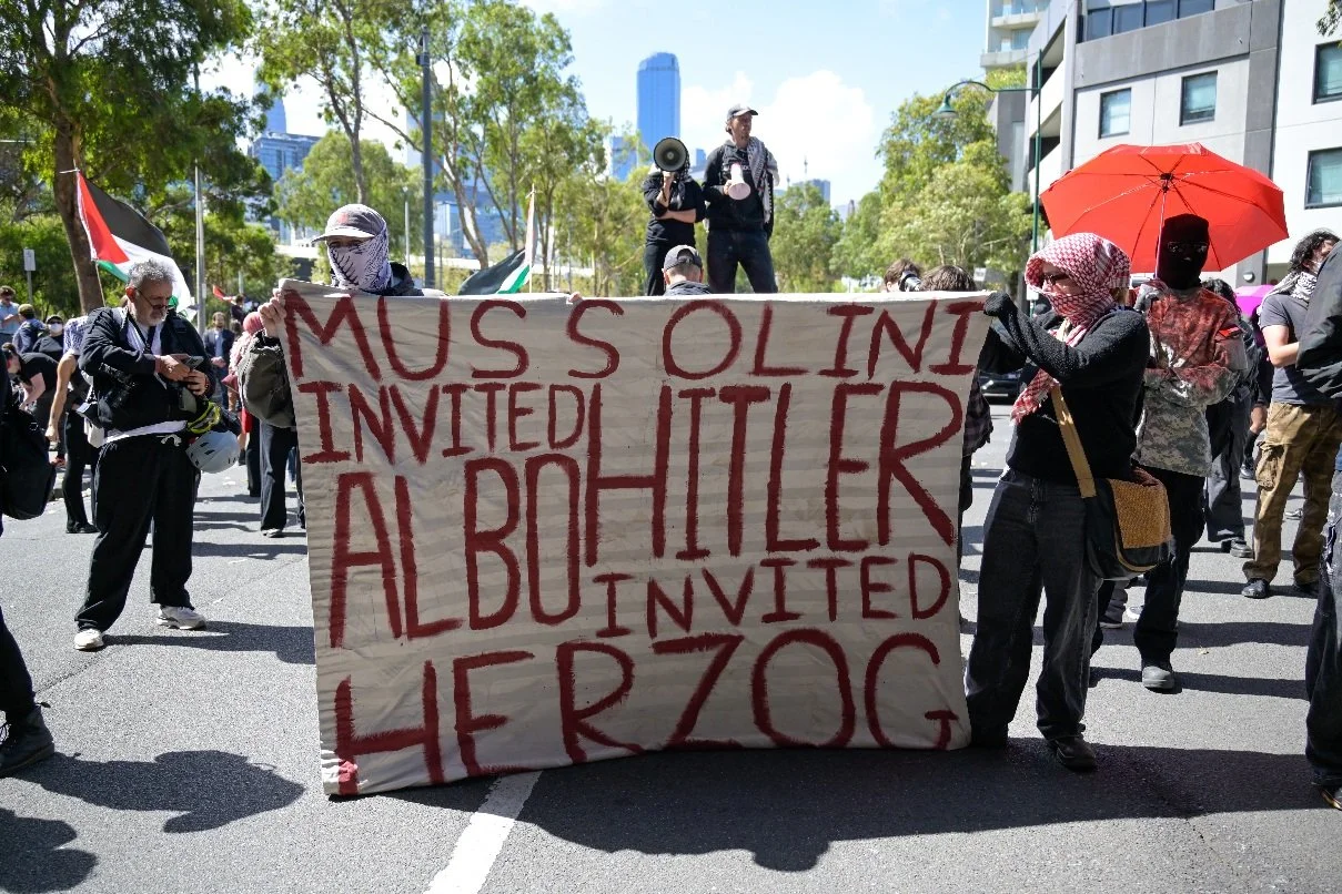 Documentary photograph taken during the Israeli President’s visit to Melbourne on 12 February, capturing protests in Southbank and the CBD, police security measures, and street-level tensions. | photo by Farhad Rajabali