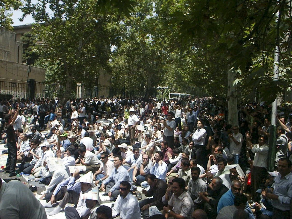 This image is part of the Green Movement documentary series, recorded during the 2009 protests in Tehran, Iran. The project documents everyday scenes and public demonstrations, reflecting resilience, collective presence, and civilian life during a si