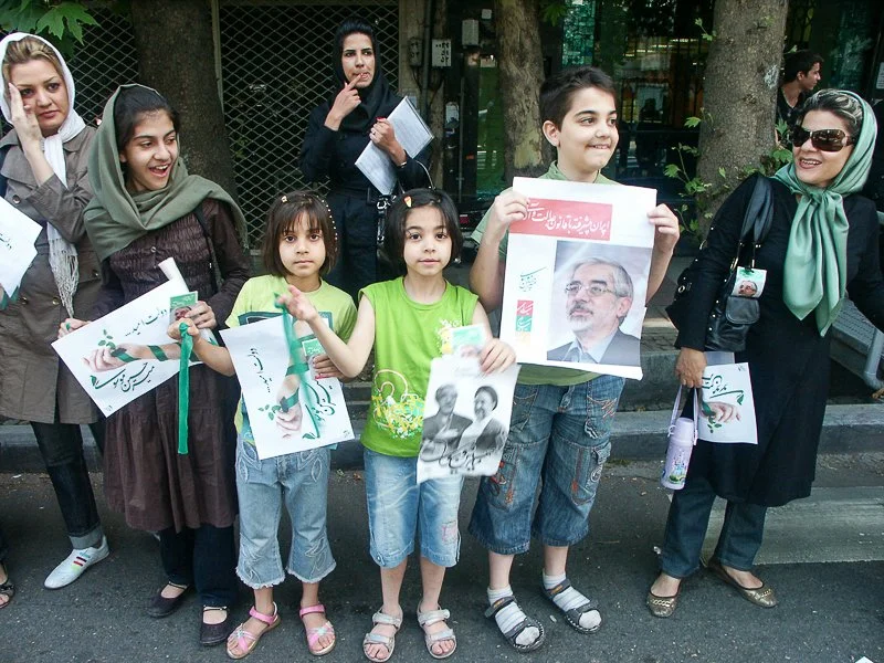Editorial photograph from the Green Movement protests in Iran during 2009–2010, documenting public demonstrations, civic resistance, and everyday life under heightened security conditions. Part of a long-form documentary project by photographer Farha