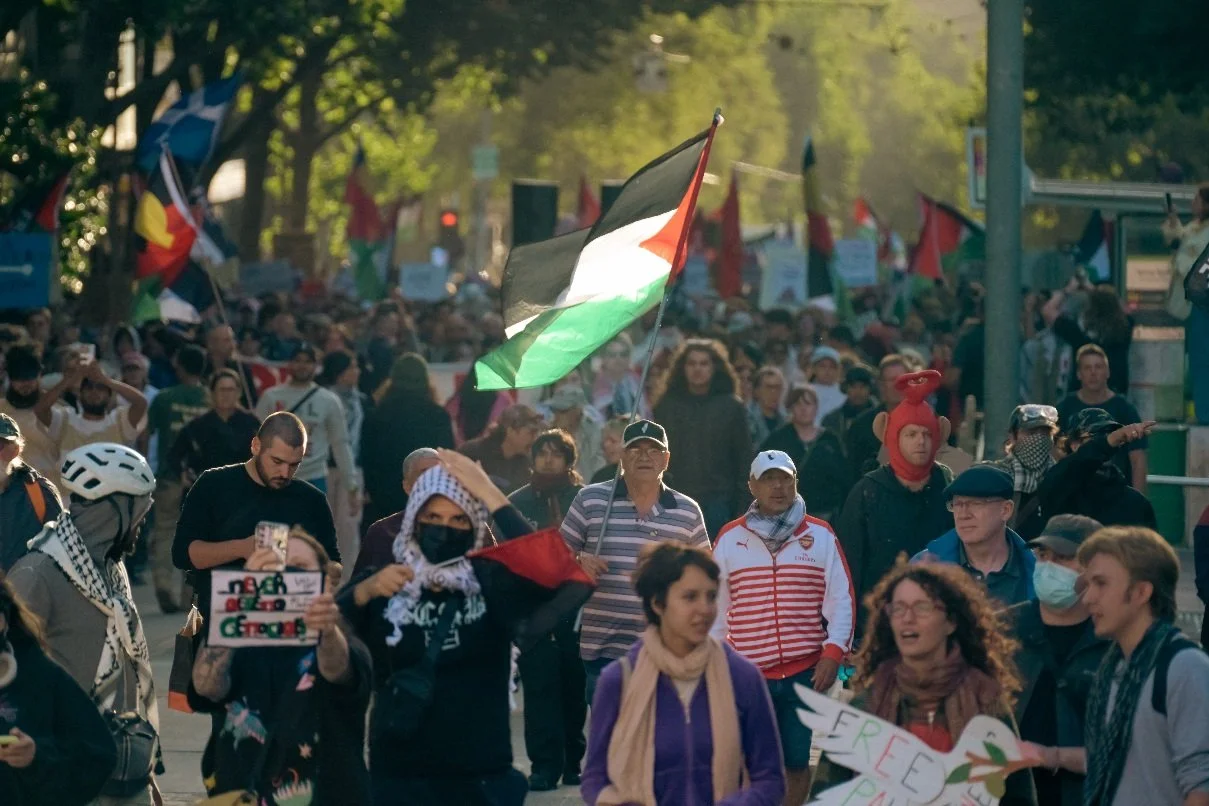 Documentary photograph taken during the Israeli President’s visit to Melbourne on 12 February, capturing protests in Southbank and the CBD, police security measures, and street-level tensions. | photo by Farhad Rajabali