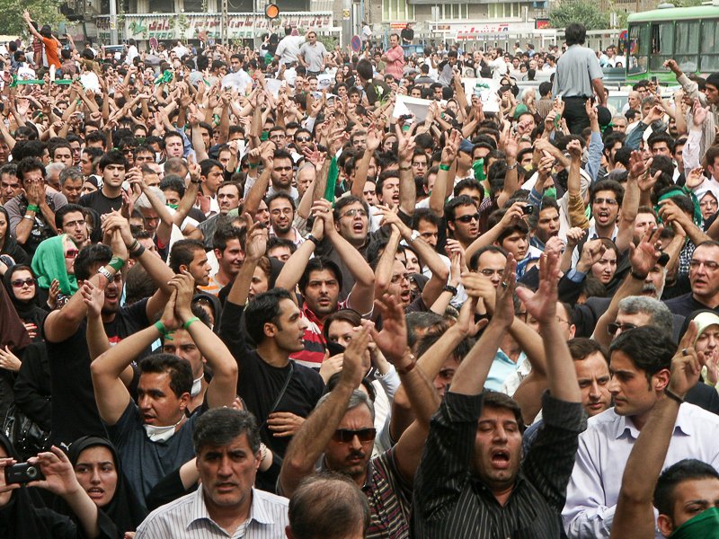 Editorial photograph from the Green Movement protests in Iran during 2009–2010, documenting public demonstrations, civic resistance, and everyday life under heightened security conditions. Part of a long-form documentary project by photographer Farha