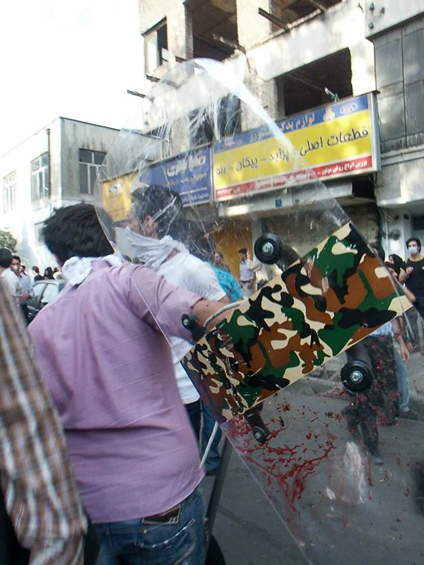 Editorial photograph from the Green Movement protests in Iran during 2009–2010, documenting public demonstrations, civic resistance, and everyday life under heightened security conditions. Part of a long-form documentary project by photographer Farha