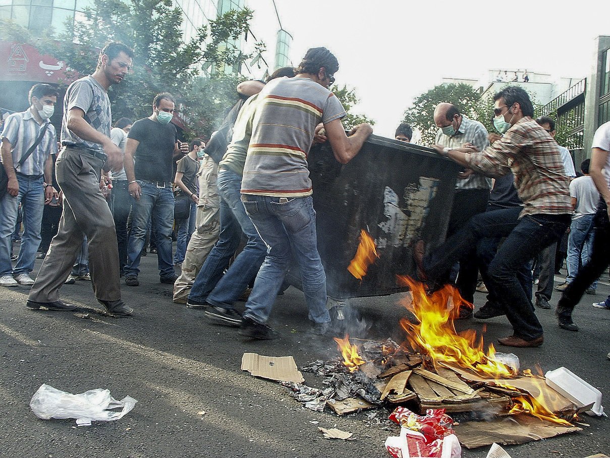This image is part of the Green Movement documentary series, recorded during the 2009 protests in Tehran, Iran. The project documents everyday scenes and public demonstrations, reflecting resilience, collective presence, and civilian life during a si