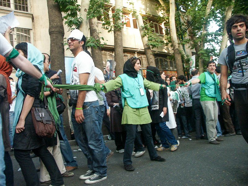 Editorial photograph from the Green Movement protests in Iran during 2009–2010, documenting public demonstrations, civic resistance, and everyday life under heightened security conditions. Part of a long-form documentary project by photographer Farha