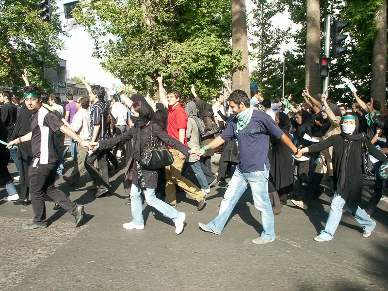 Editorial photograph from the Green Movement protests in Iran during 2009–2010, documenting public demonstrations, civic resistance, and everyday life under heightened security conditions. Part of a long-form documentary project by photographer Farha