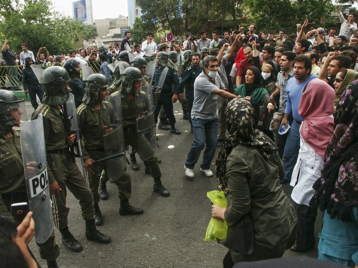 This image is part of the Green Movement documentary series, recorded during the 2009 protests in Tehran, Iran. The project documents everyday scenes and public demonstrations, reflecting resilience, collective presence, and civilian life during a si