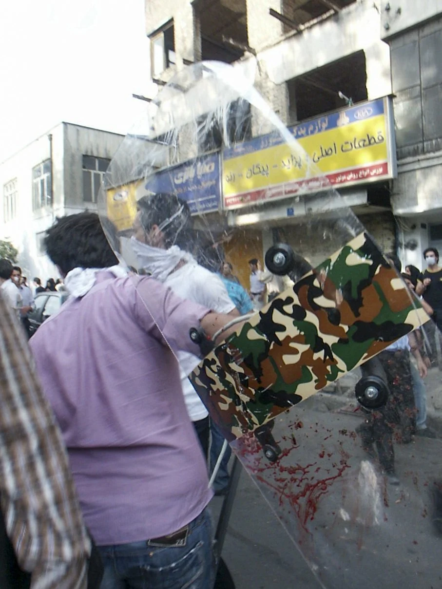 This image is part of the Green Movement documentary series, recorded during the 2009 protests in Tehran, Iran. The project documents everyday scenes and public demonstrations, reflecting resilience, collective presence, and civilian life during a si
