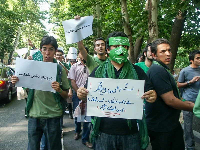 Editorial photograph from the Green Movement protests in Iran during 2009–2010, documenting public demonstrations, civic resistance, and everyday life under heightened security conditions. Part of a long-form documentary project by photographer Farha