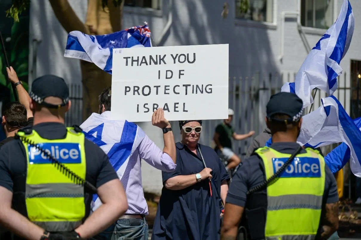 Documentary photograph taken during the Israeli President’s visit to Melbourne on 12 February 2026, capturing protests in Southbank and the CBD, police security measures, and street-level tensions. Photo by Farhad Rajabali | Artssie