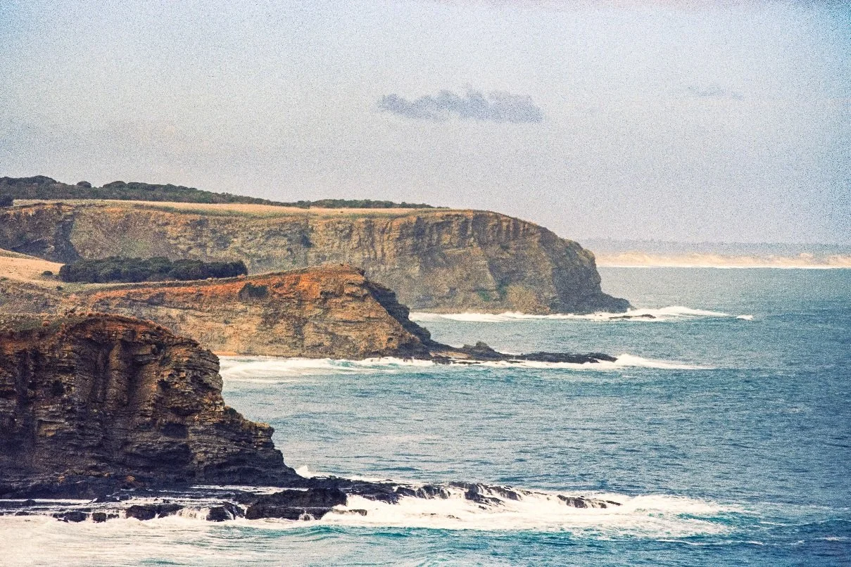 Coastal cliffs and ocean waves at Flinders Blowhole, Mornington Peninsula, Victoria, Australia — photographed on analog Nikon film.