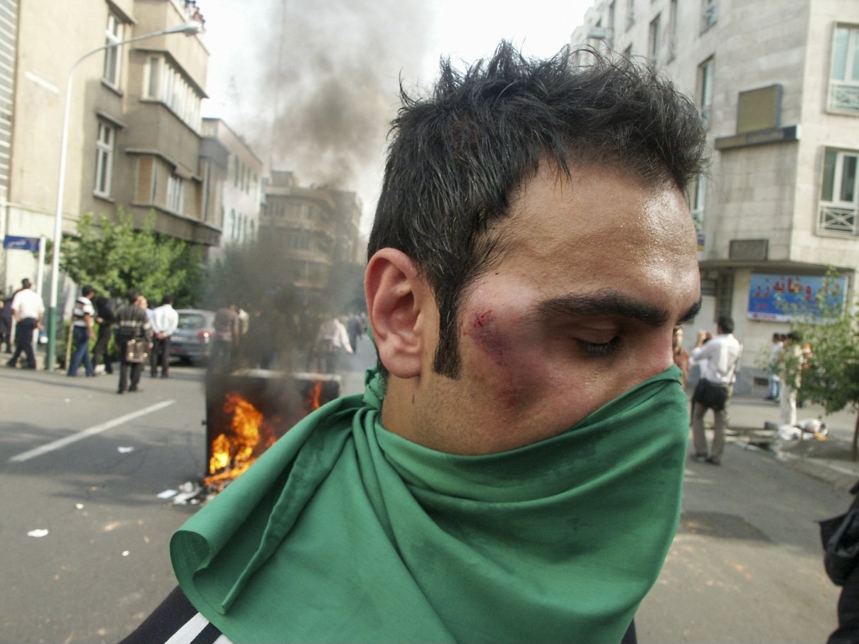 This image is part of the Green Movement documentary series, recorded during the 2009 protests in Tehran, Iran. The project documents everyday scenes and public demonstrations, reflecting resilience, collective presence, and civilian life during a si