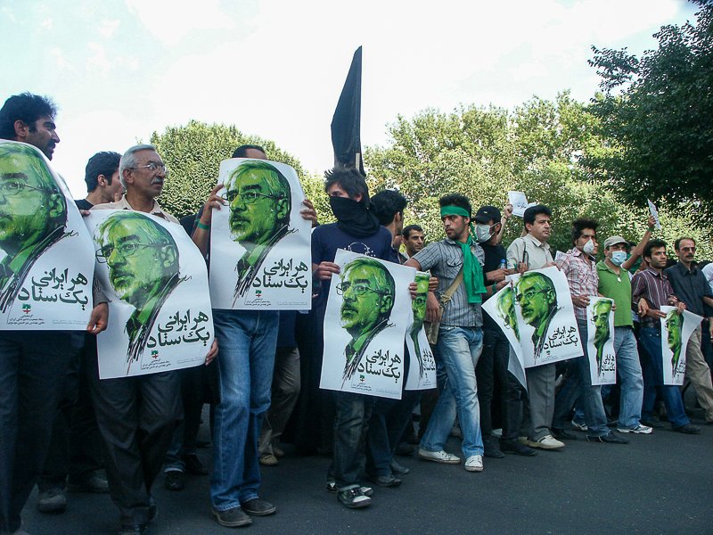 Editorial photograph from the Green Movement protests in Iran during 2009–2010, documenting public demonstrations, civic resistance, and everyday life under heightened security conditions. Part of a long-form documentary project by photographer Farha