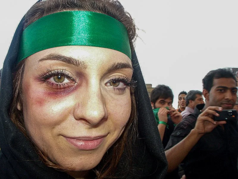 Editorial photograph from the Green Movement protests in Iran during 2009–2010, documenting public demonstrations, civic resistance, and everyday life under heightened security conditions. Part of a long-form documentary project by photographer Farha
