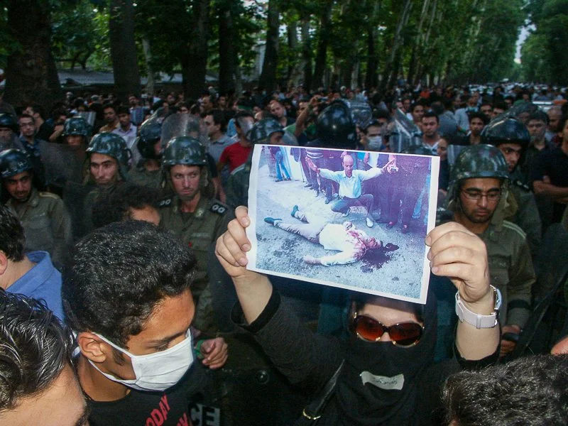 Editorial photograph from the Green Movement protests in Iran during 2009–2010, documenting public demonstrations, civic resistance, and everyday life under heightened security conditions. Part of a long-form documentary project by photographer Farha