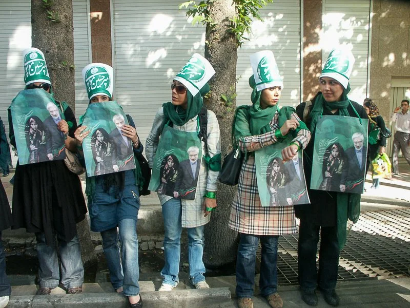 Editorial photograph from the Green Movement protests in Iran during 2009–2010, documenting public demonstrations, civic resistance, and everyday life under heightened security conditions. Part of a long-form documentary project by photographer Farha