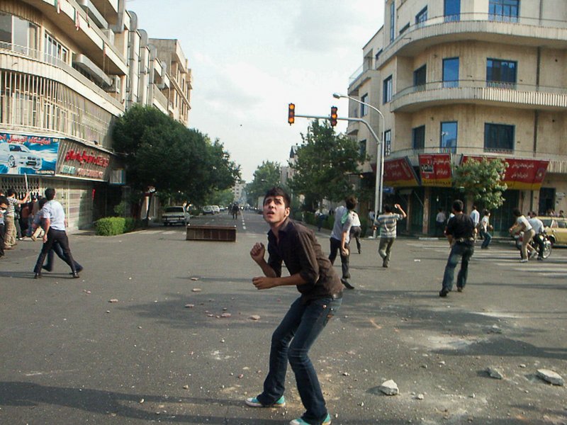Editorial photograph from the Green Movement protests in Iran during 2009–2010, documenting public demonstrations, civic resistance, and everyday life under heightened security conditions. Part of a long-form documentary project by photographer Farha