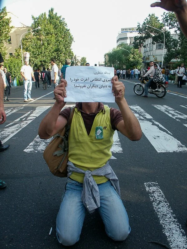 Editorial photograph from the Green Movement protests in Iran during 2009–2010, documenting public demonstrations, civic resistance, and everyday life under heightened security conditions. Part of a long-form documentary project by photographer Farha