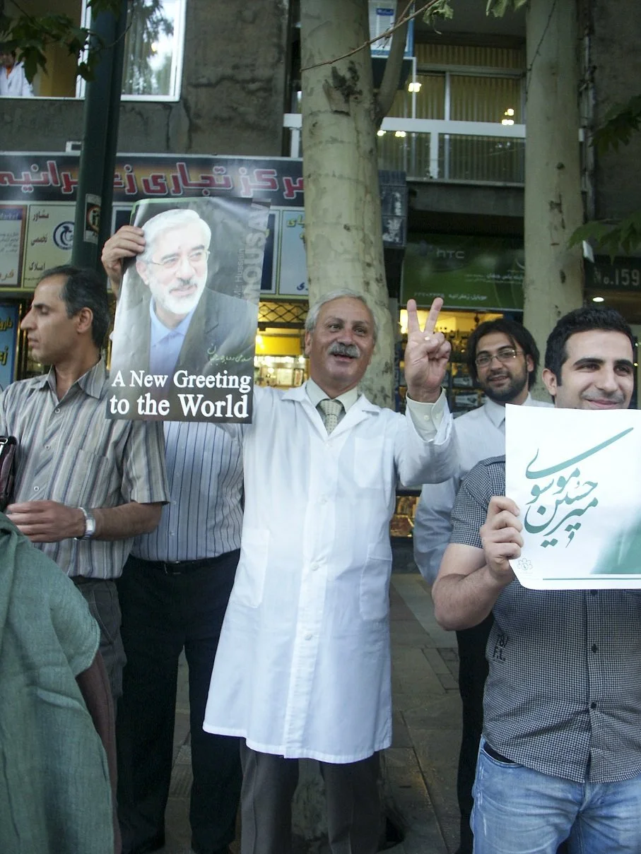 This image is part of the Green Movement documentary series, recorded during the 2009 protests in Tehran, Iran. The project documents everyday scenes and public demonstrations, reflecting resilience, collective presence, and civilian life during a si