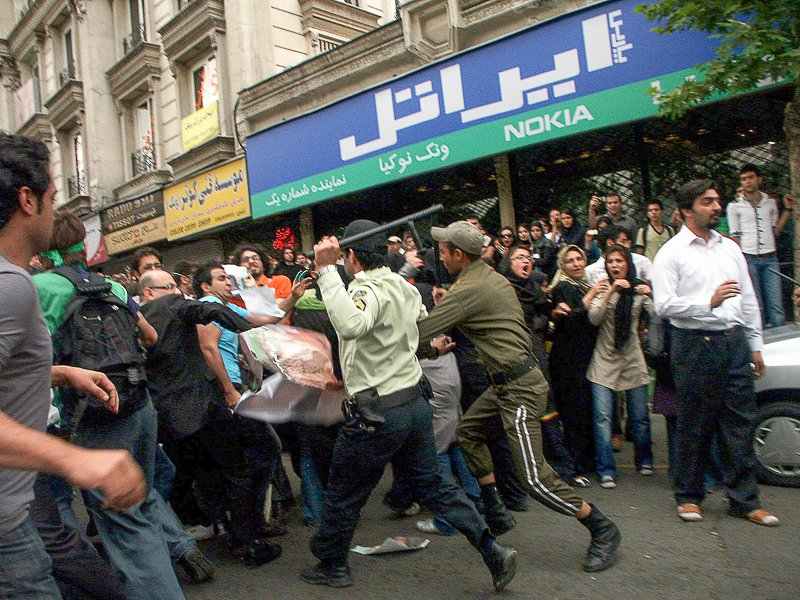 Editorial photograph from the Green Movement protests in Iran during 2009–2010, documenting public demonstrations, civic resistance, and everyday life under heightened security conditions. Part of a long-form documentary project by photographer Farha