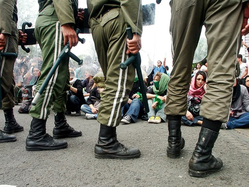 Editorial photograph from the Green Movement protests in Iran during 2009–2010, documenting public demonstrations, civic resistance, and everyday life under heightened security conditions. Part of a long-form documentary project by photographer Farha