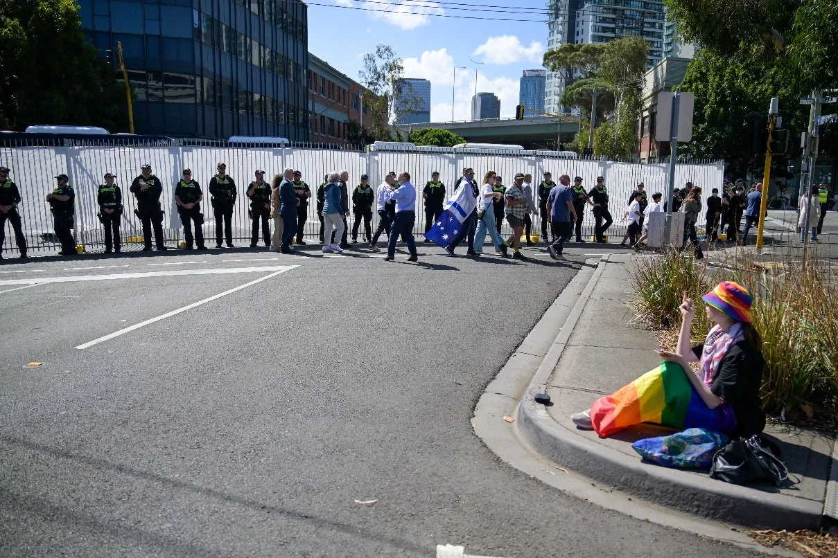 Documentary photograph taken during the Israeli President’s visit to Melbourne on 12 February, capturing protests in Southbank and the CBD, police security measures, and street-level tensions. | photo by Farhad Rajabali