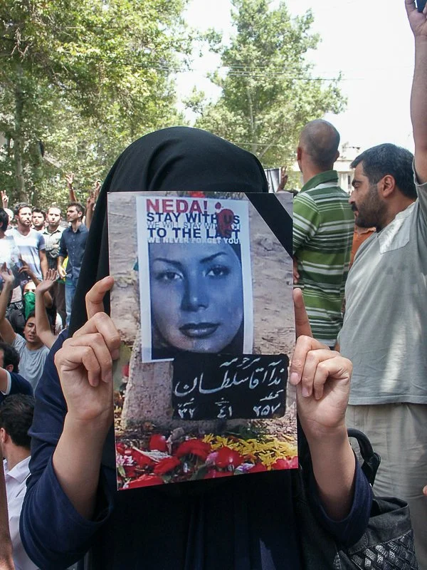 Editorial photograph from the Green Movement protests in Iran during 2009–2010, documenting public demonstrations, civic resistance, and everyday life under heightened security conditions. Part of a long-form documentary project by photographer Farha