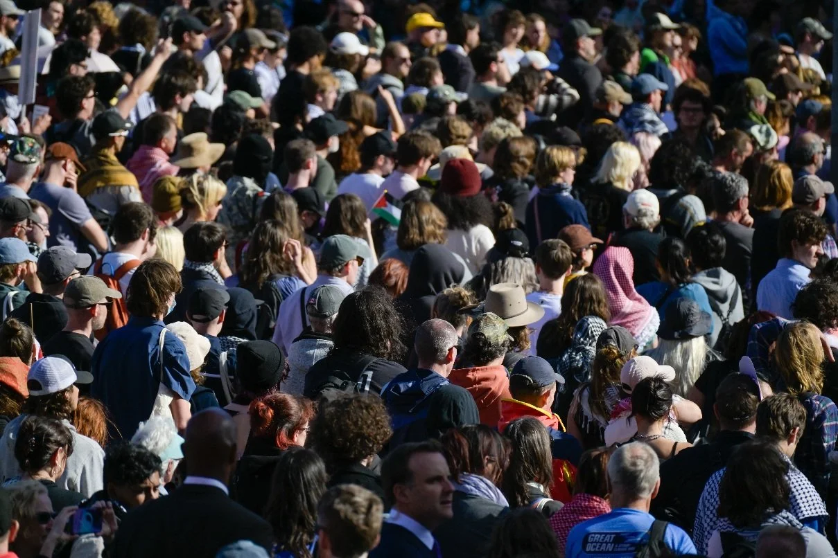 Documentary photograph taken during the Israeli President’s visit to Melbourne on 12 February, capturing protests in Southbank and the CBD, police security measures, and street-level tensions. | photo by Farhad Rajabali