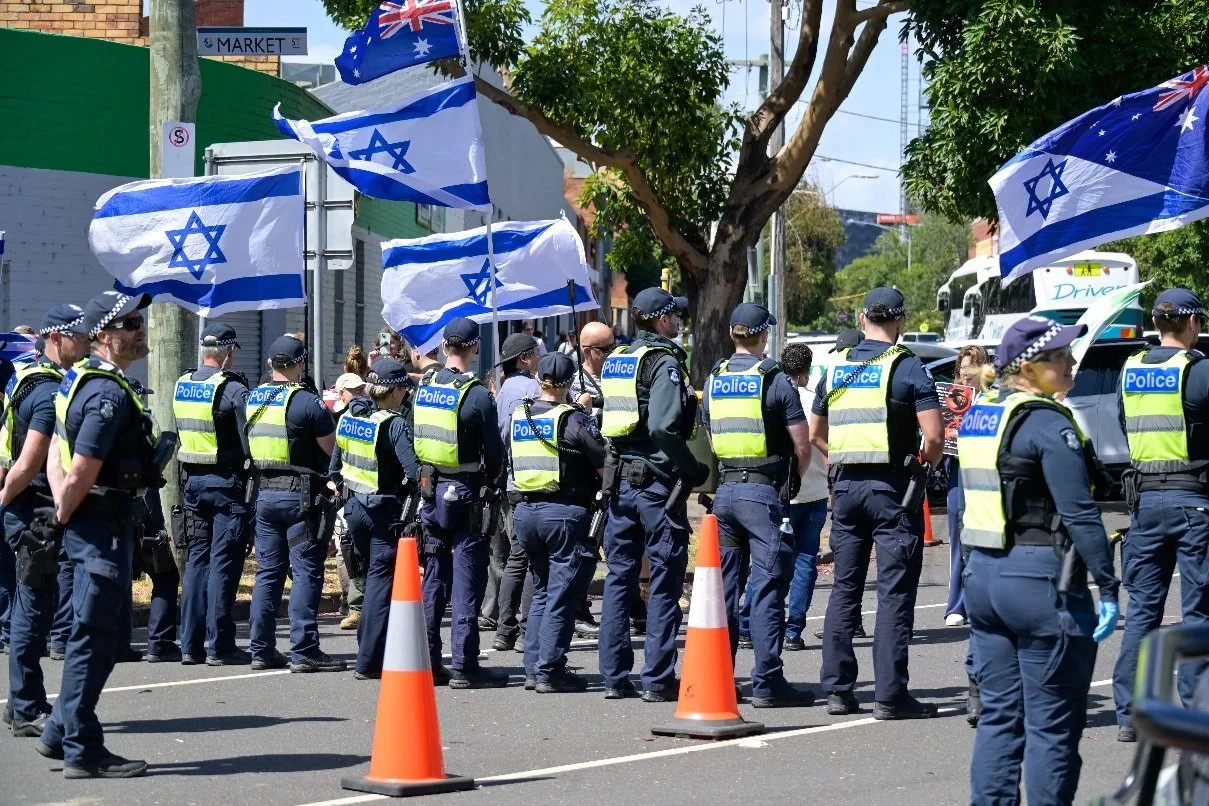 Documentary photograph taken during the Israeli President’s visit to Melbourne on 12 February, capturing protests in Southbank and the CBD, police security measures, and street-level tensions. | photo by Farhad Rajabali