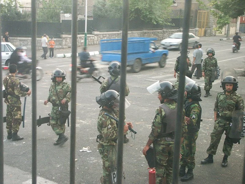 Editorial photograph from the Green Movement protests in Iran during 2009–2010, documenting public demonstrations, civic resistance, and everyday life under heightened security conditions. Part of a long-form documentary project by photographer Farha