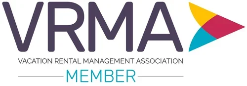 Logo of VRMA, the Vacation Rental Management Association, with the organization name and a multicolored arrow symbol, indicating membership.