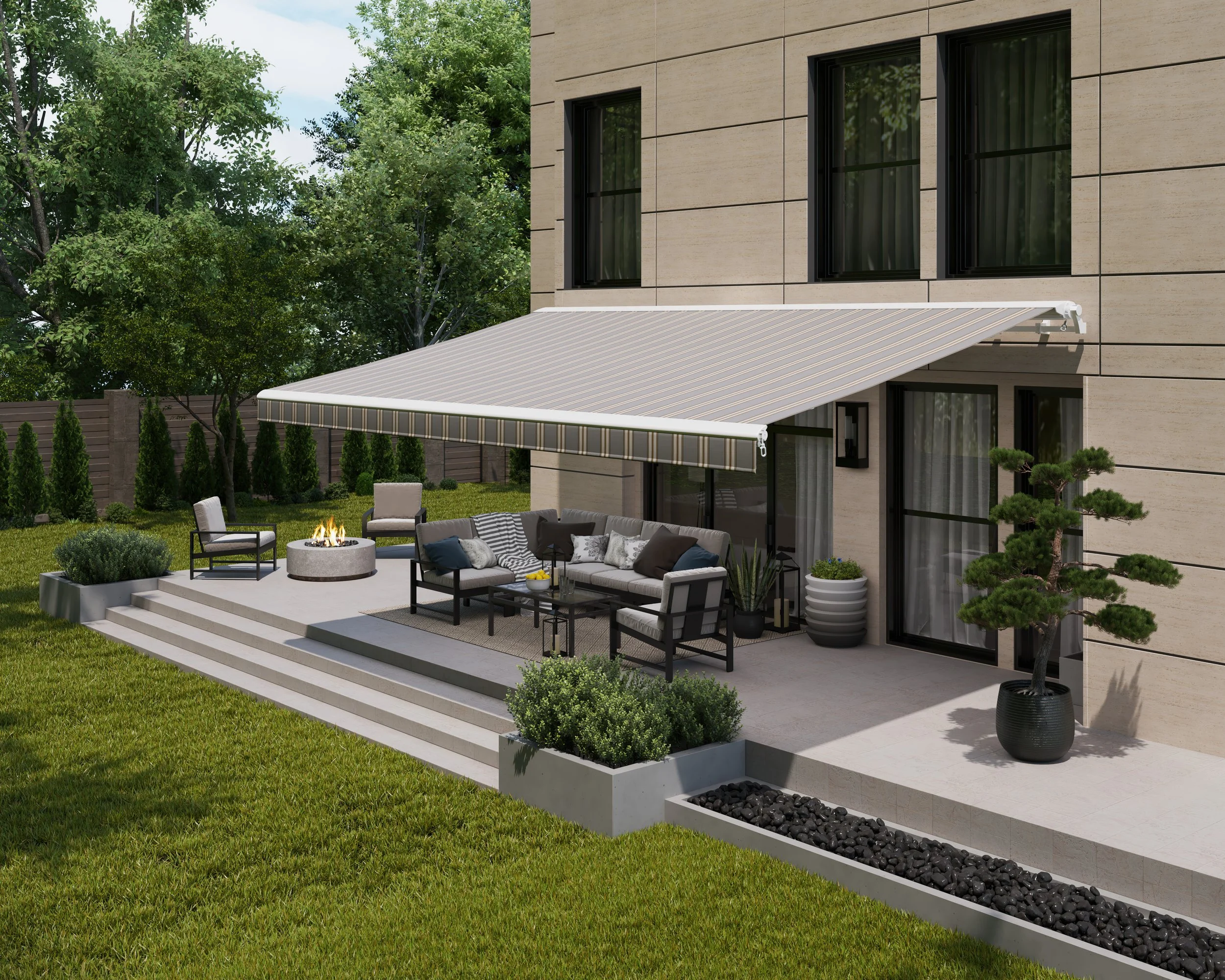 Modern house outdoor patio with beige exterior walls, black-framed windows, striped canopy, seating area with white cushions, and a fire pit, surrounded by green grass, trees, and potted plants.
