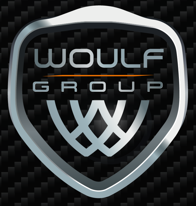 Logo of Woulf Group with stylized wolf head and shield design on a carbon fiber background.