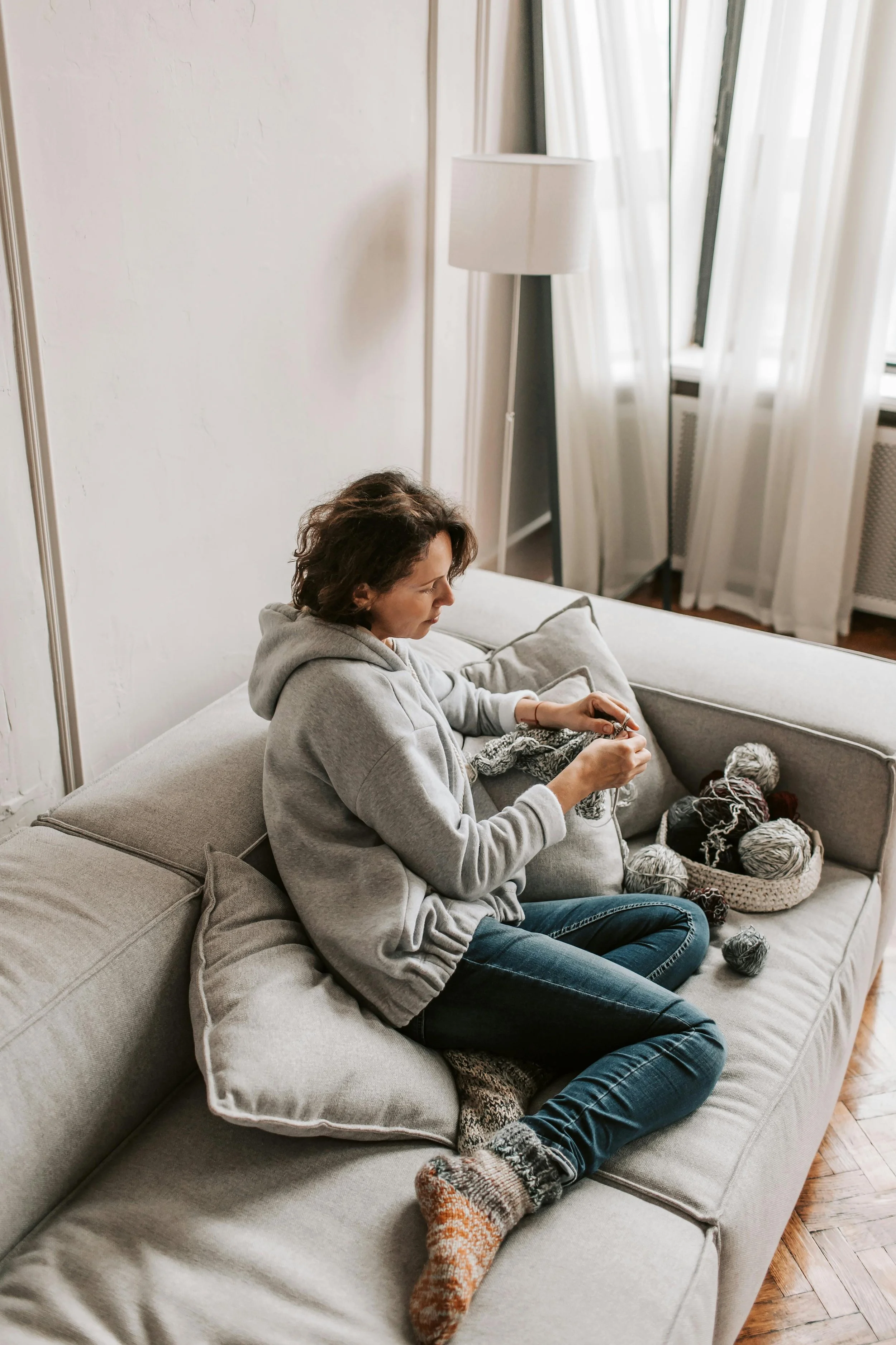 Woman sitting quietly in a calm setting representing anxiety therapy in New York City