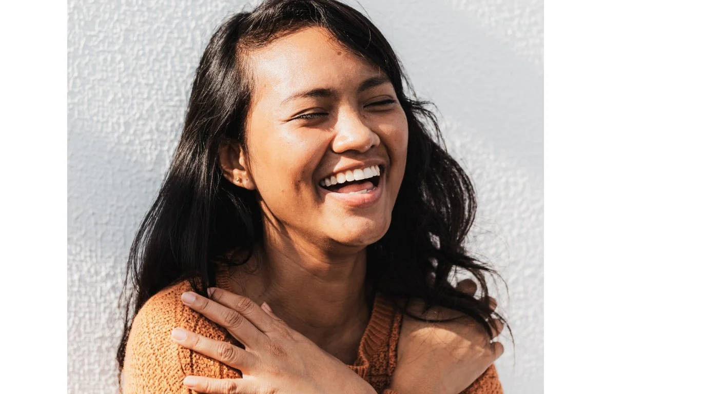 Adult smiling with confidence after OCD and body dysmorphia therapy with Robyn Stern LCSW