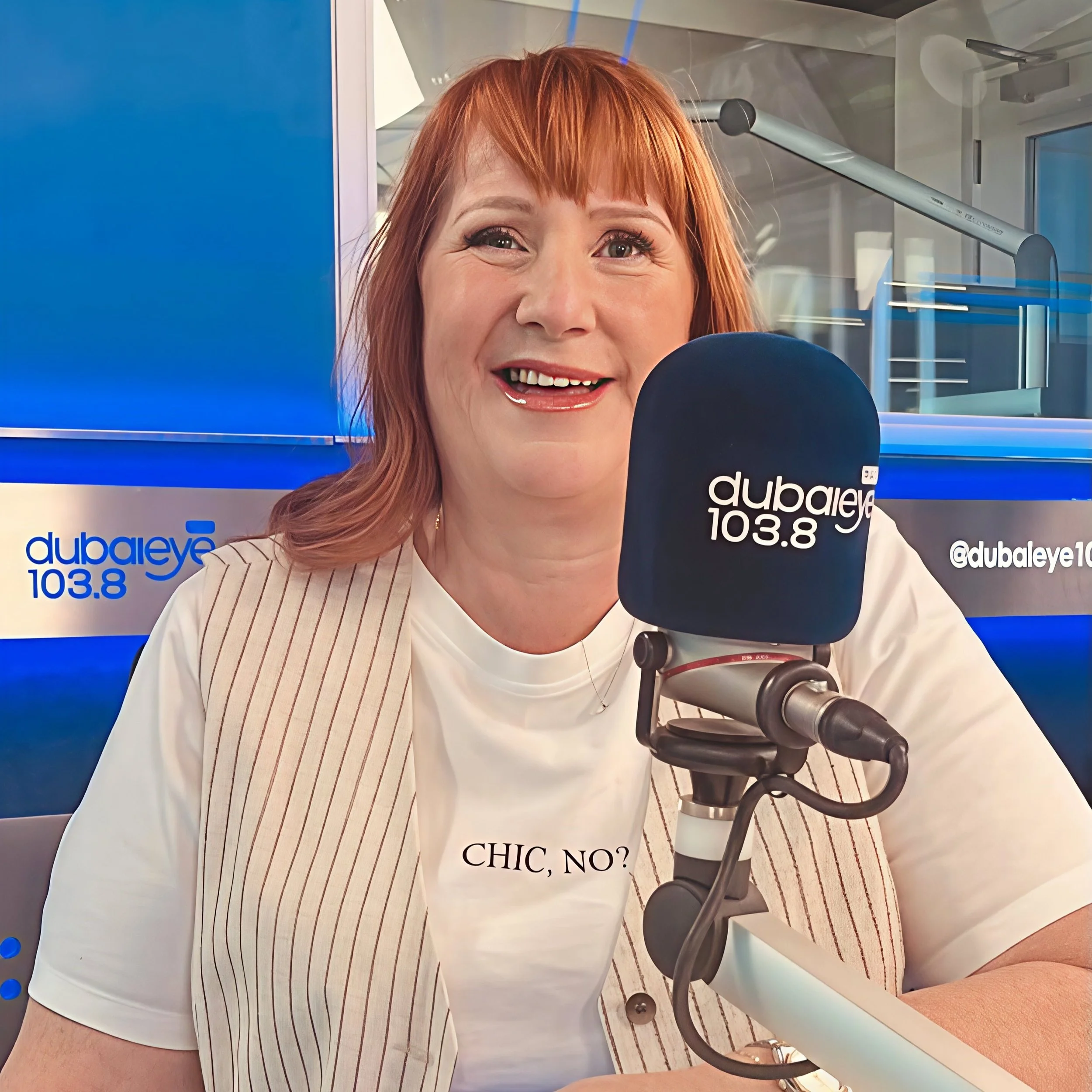 Anne with a mic at Dubai Eye