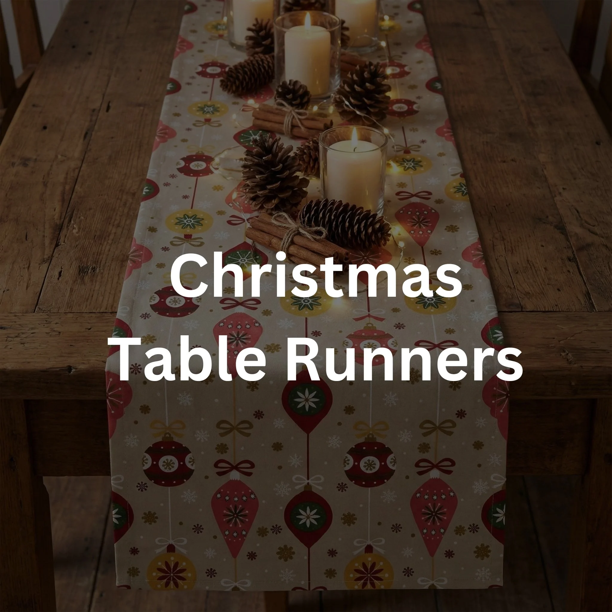 A Christmas-themed table runner on a wooden dining table decorated with pinecones, candles, and cinnamon sticks, with a festive ornament pattern.