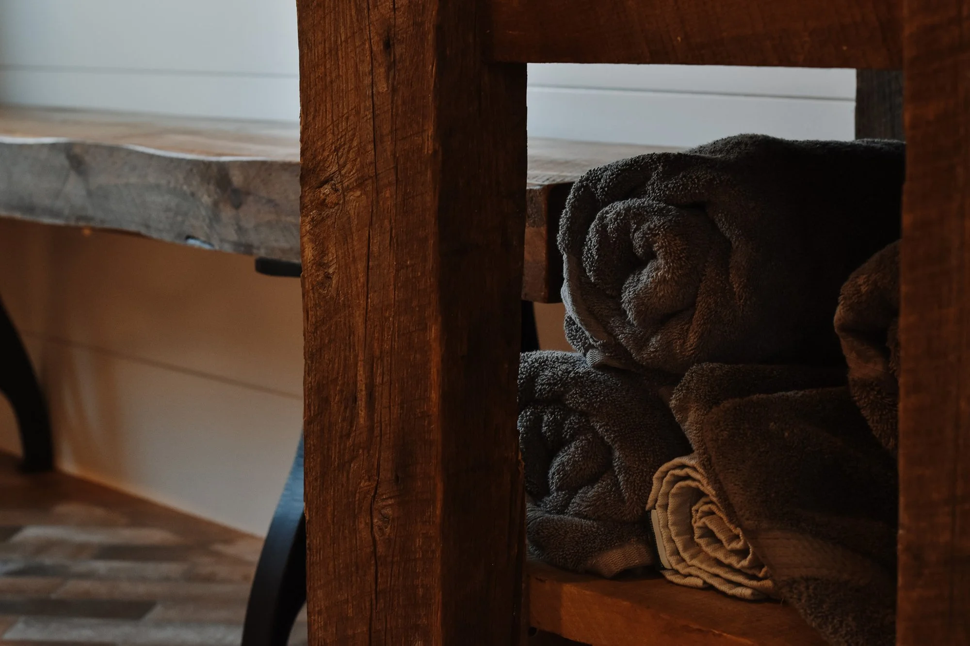 Restored Farmhouse Decor, reclaimed wood custom-made sink, wooden reclaimed wood bench, cozt charcoal sink toels under the sink